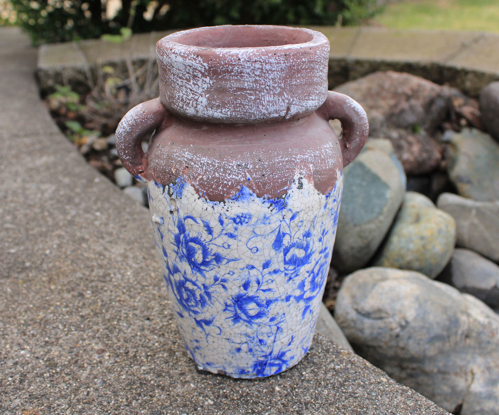 Vintage blue and white ceramic vase. Ancient Asian reproduction of a classic storage jug