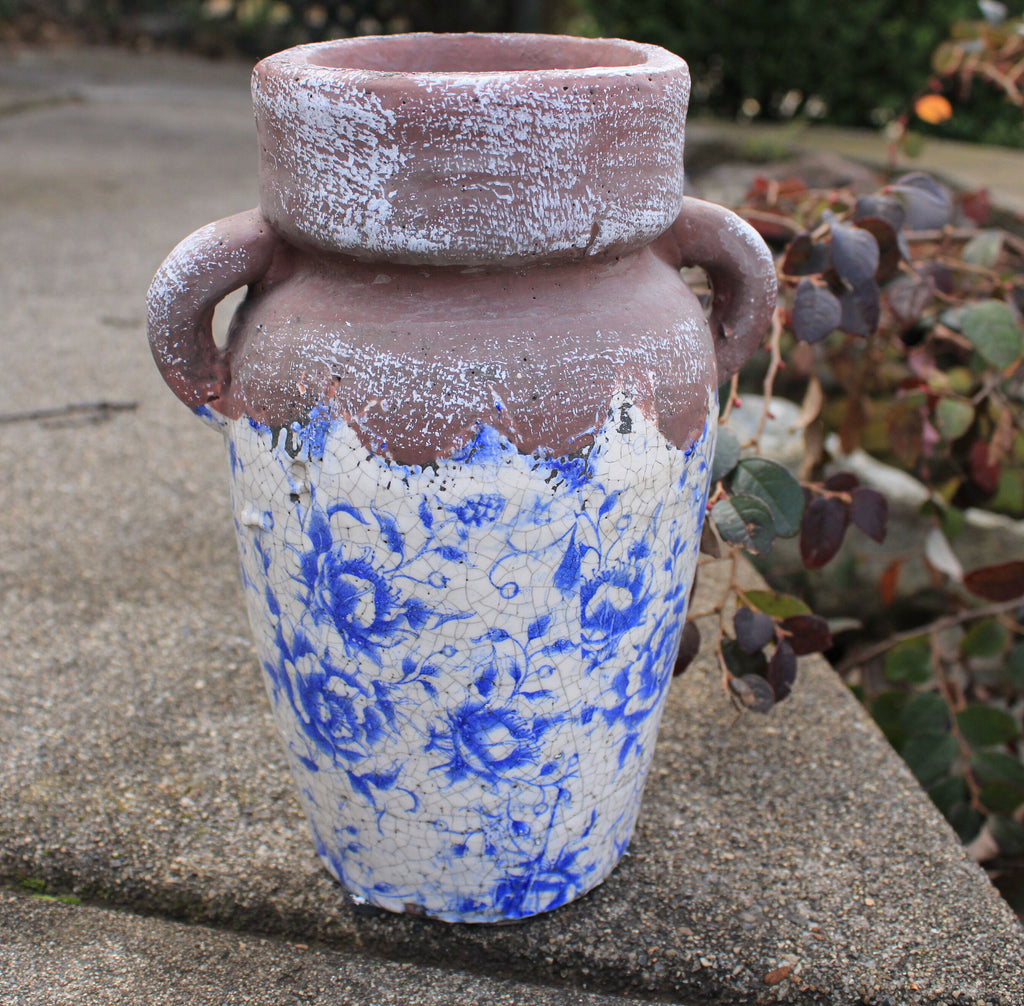 Vintage blue and white ceramic vase. Ancient Asian reproduction of a classic storage jug